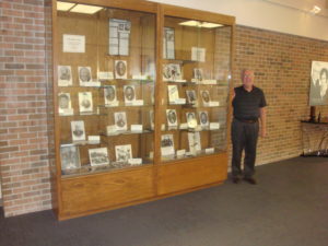 Curator Jim Marckel is standing beside the Museum Hall Display